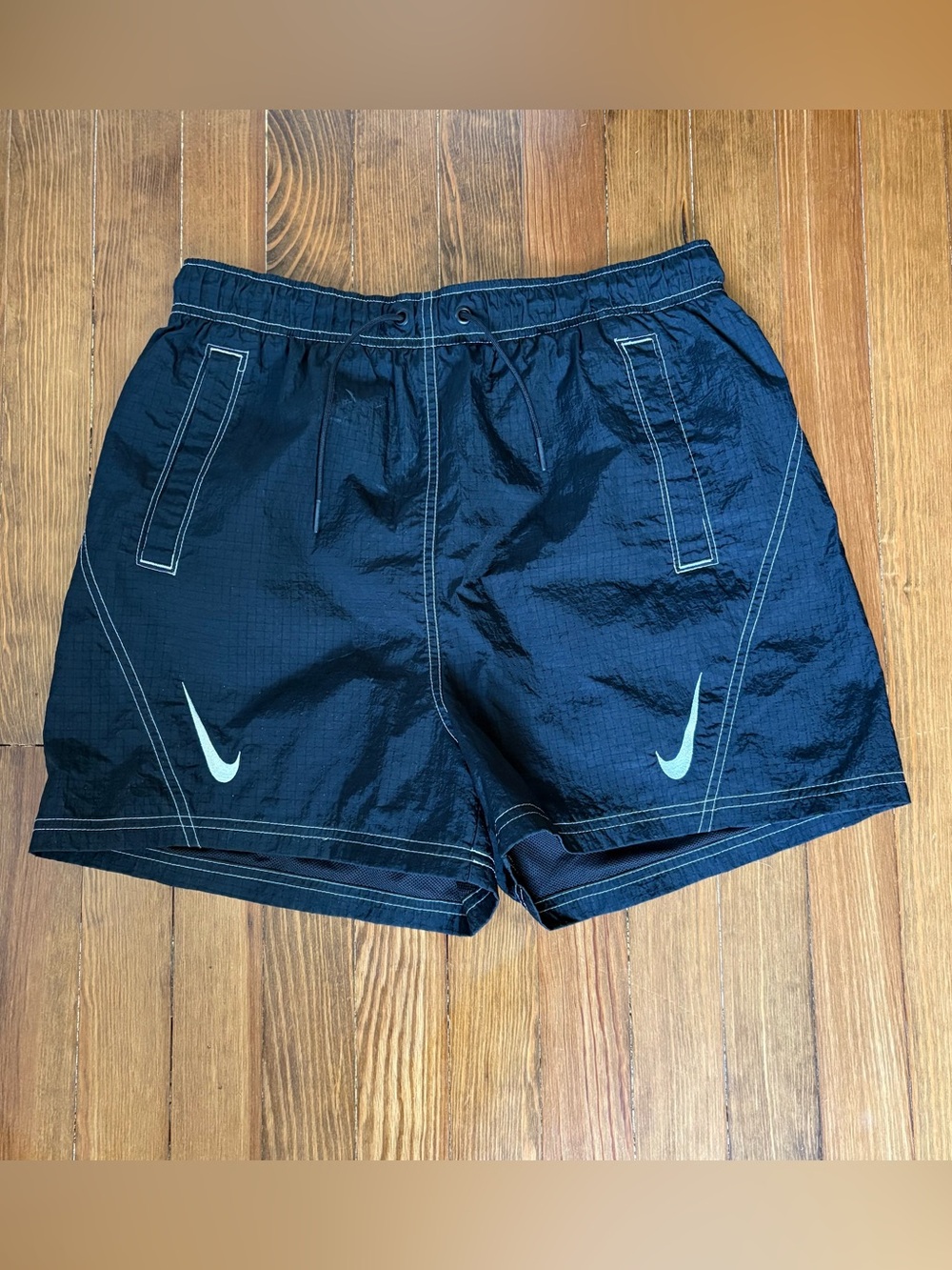 Nike Black Windbreaker Shorts with White Logo and Stitching